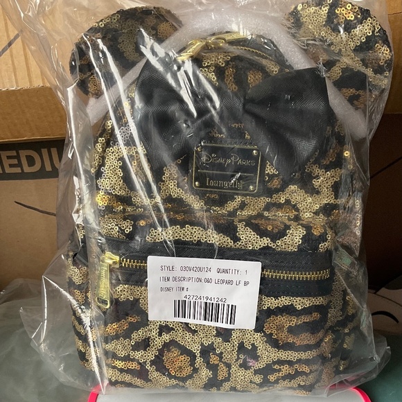 LOUNGEFLY Handbags - LOUNGEFLY DISNEY PARKS CHEETAH PRINT SEQUENCED BACKPACK NWT